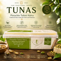 Tunas Pistachio Tahini Halva packaging with green label on a wooden surface with pistachios and leaves.
